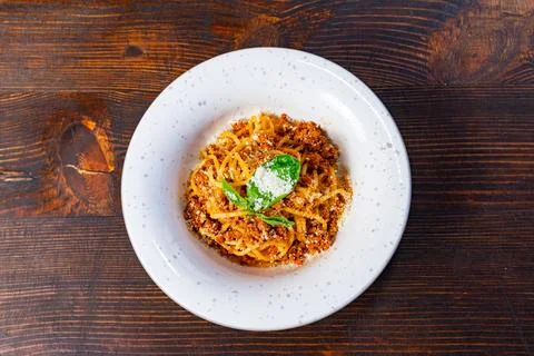 A generous serving of spaghetti topped with rich meat sauce Stock Photos