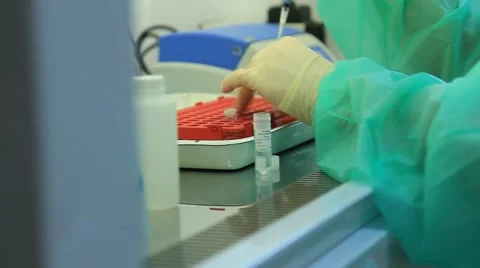 Genetic laboratorie: examination of samples (shot on dolly) Stock Footage