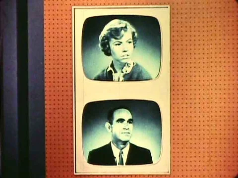 A geneticist in a studio talks to various people on TV screens about genetics Stock Footage 75096430