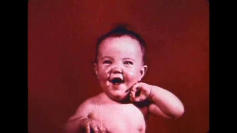 A geneticist in a studio talks to various people on TV screens about genetics. Stock Footage 106908191