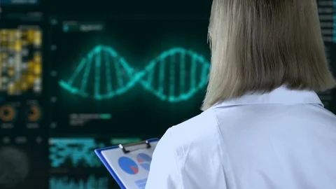 Geneticist watching DNA analysis process on screen, genetic modifications Stock Footage 106520157