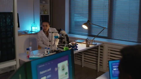 Geneticists Discussing Patients Card on Computer while Researching in Lab Stock Footage 332361401