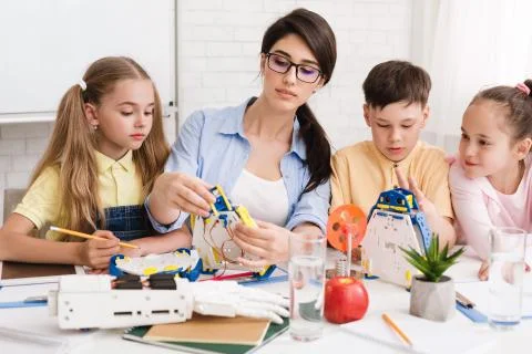 Genius kids learning about robots and coding Stock Photos