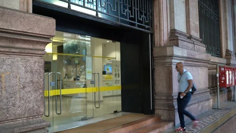 Genoa - A man is entering the Post Office Video stock 114657525