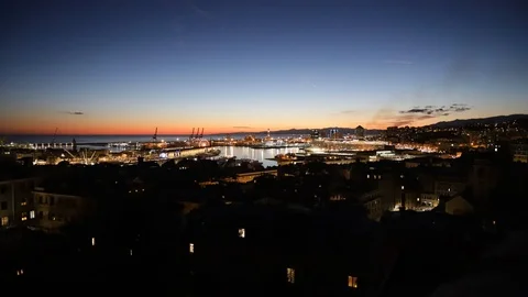 Genoa at sunset with port lights Stock Footage 102153386