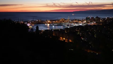 Genoa at sunset seen from the hill towards the port in time lapse Stock-Footage 101498149