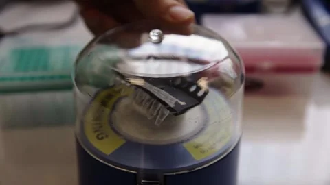 Genomics Lab -  machine used to mix small test tube contents Stock Footage 272156108