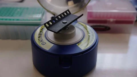 Genomics Lab -  machine used to mix small test tube contents Stock Footage 272156339