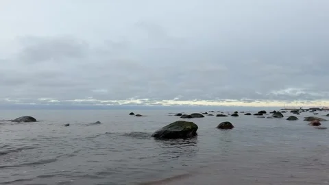 Gentle Baltic Sea Waves Reaching Sandy Shore with Stones in 4K with Sound Stock Footage 323010183