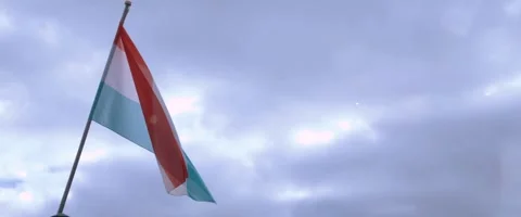 Gentle Breeze on Dutch Flag - Cloudy, Cold Day Background Stock Footage 260933482