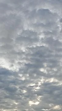 Gentle Cloud Formation Under a Gray Sky Stock Photos
