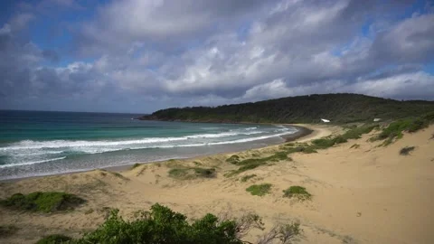 Gentle Distant Waves and Soft Cloud Over One Mile Beach - Summer Day - 4K 動画素材 150919096