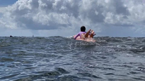 Gentle Float On Surfboard Amid Expansive Ocean And Cloudy Sky Stock-Footage 329278629