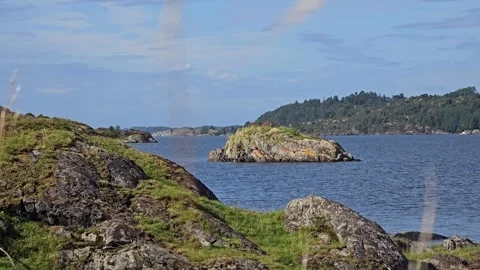 Gentle Grassy Cliffs Descending to the Sea, Round Island in Distance Stock-Footage 344895624