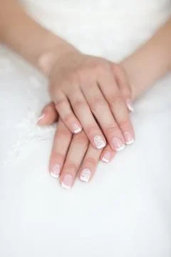 Gentle hands of the bride Stock Photos