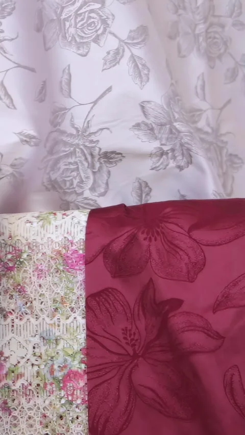 Gentle Hands Curating a Symphony of Patterned Fabrics for a New Creation Stock Footage 341068474