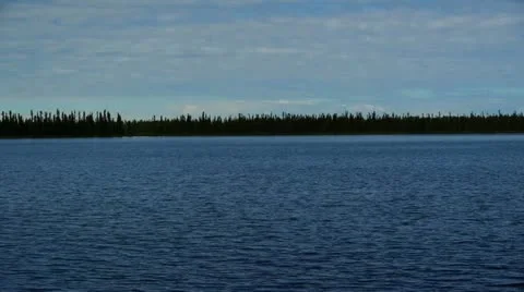 Gentle Lake with Distant Shore Stock Footage 12048047
