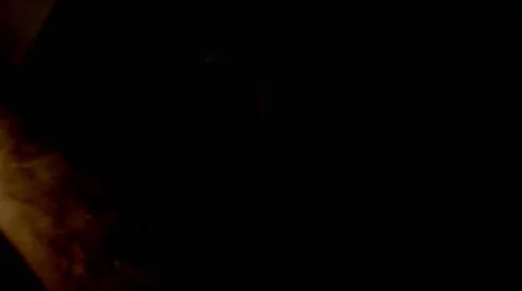 Gentle Light Moves on Mongolian Mask in the Dark Closeup Stock Footage 62636078