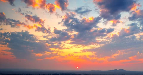 Gentle motion aerial hyper lapse during a colorful but hazy sunrise over Stock Footage 159209788