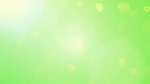 Gentle motion of glowing yellow hearts floating and sparkling in soft green and Video stock 338221653