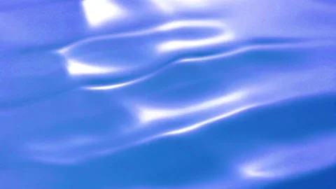 Gentle movement of blue liquid creating soft waves and reflections Stock Footage 327570581