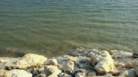 The gentle movement of the waves on the edge of the lake Stock Footage 290286757