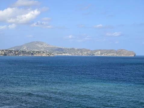 Gentle ocean waves and distant silhouettes, peaceful open sea with layered .. Photos