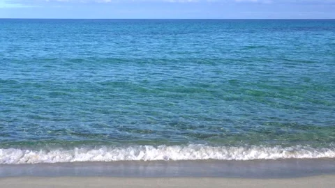 Gentle Ocean Waves On A Beautiful Sandy Beach Stock Footage 266885618