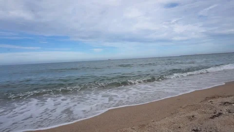 Gentle Ocean Waves Break Onto Sandy Shore, Angle 2/2, HD Stock Footage 194986037