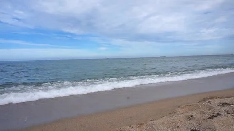 Gentle Ocean Waves Break Onto Sandy Shore, Angle 1/2, HD Stock Footage 194986039