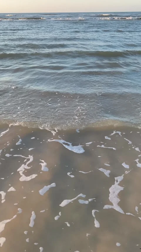 Gentle Ocean Waves Crashing on Sandy Beach Vertical Stock Footage 340380231