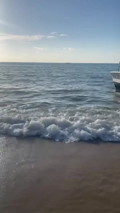 Gentle Ocean Waves Crashing on Sandy Beach Shore Stock Footage 342265563