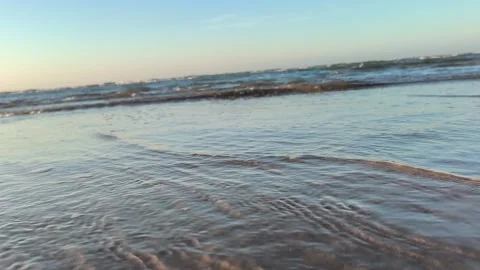Gentle Ocean Waves Lapping on Sandy Beach Shoreline Stock Footage 340215854