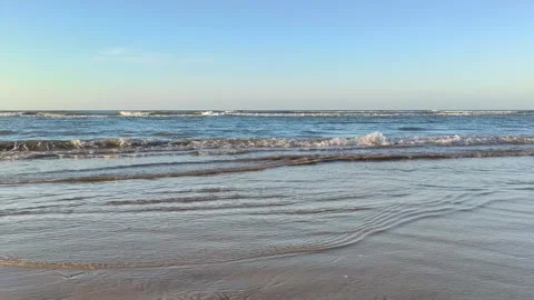 Gentle Ocean Waves Lapping on Tropical Sandy Beach Shoreline Stock Footage 340489552
