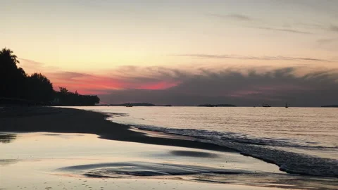Gentle ocean waves roll toward the shore in the fresh morning air 스톡 동영상 325594158
