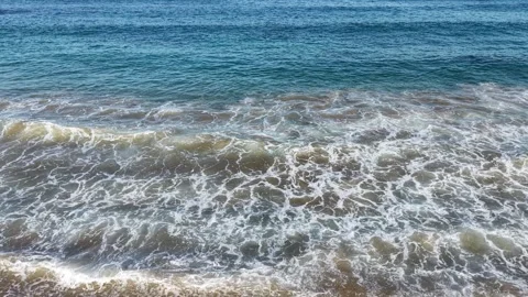 Gentle Ocean Waves Rolling onto the Beach - Aerial Drone Footage Stock Footage 337865816