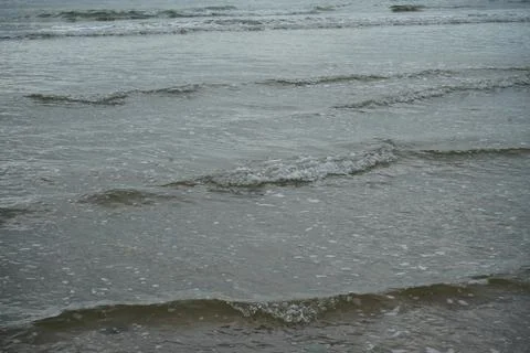 Gentle Ocean Waves Rolling Onto Llanddwyn Beach, Anglesey, North Wales. Stock Photos