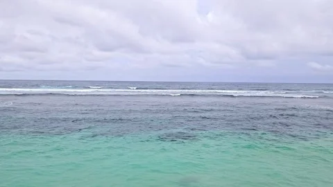 Gentle ocean waves rolling onto the shore Stock Footage 301596568