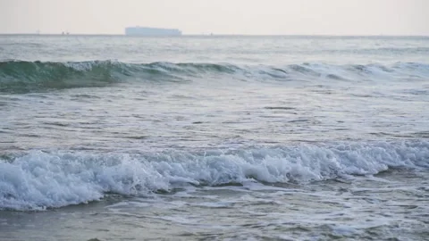 Gentle Ocean Waves Rolling Toward The Sandy Shoreline On A Calm Sunny Day Stock Footage 342003613