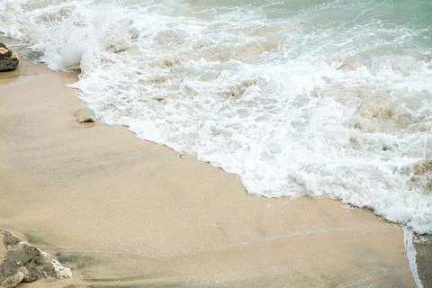 Gentle Ocean Waves Rolling Toward the Beach, Sparkling in the Sunlight and .. Stock Photos