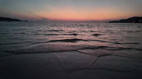 Gentle Ocean Waves Rolling Onto Tropical Beach at Sunset Видео 335357225