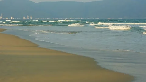 Gentle Ocean Waves on Sandy Beach Stock Footage 334907806