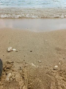 Gentle ocean waves on sandy beach in Villefranche-sur-Mer Fotos de archivo