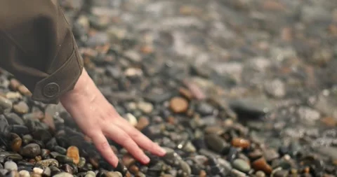 Gentle Ocean Waves Washing Over Pebbles Video stock 338217085