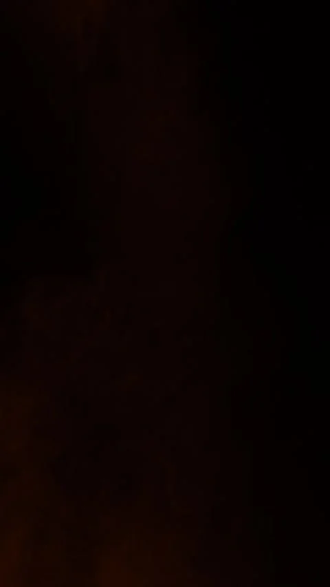Gentle orange ember fog clouds on black background, vertical format Stock Footage 340130688