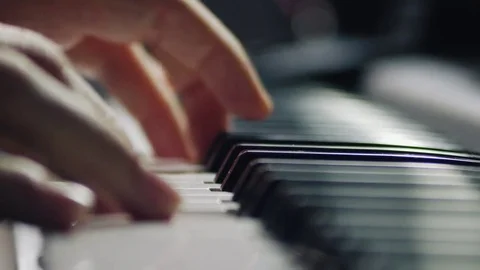 Gentle piano playing by a skilled master professional musician pianist Stock Footage