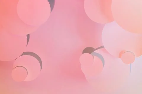 Gentle pink abstract pattern of different circles fly in radial gradient with 写真素材