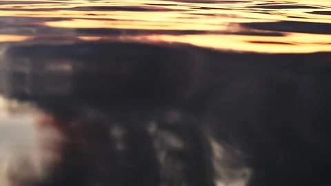 Gentle ripples on lake surface at sunset Stock Footage 315089917