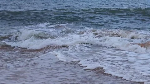 Gentle Small Waves Hitting Sandy Beach Video stock 334643785