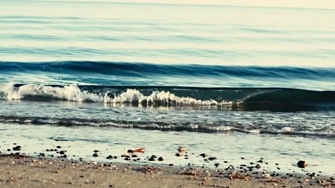 Gentle small waves rolling in on tropical beach Stock Footage 252241029